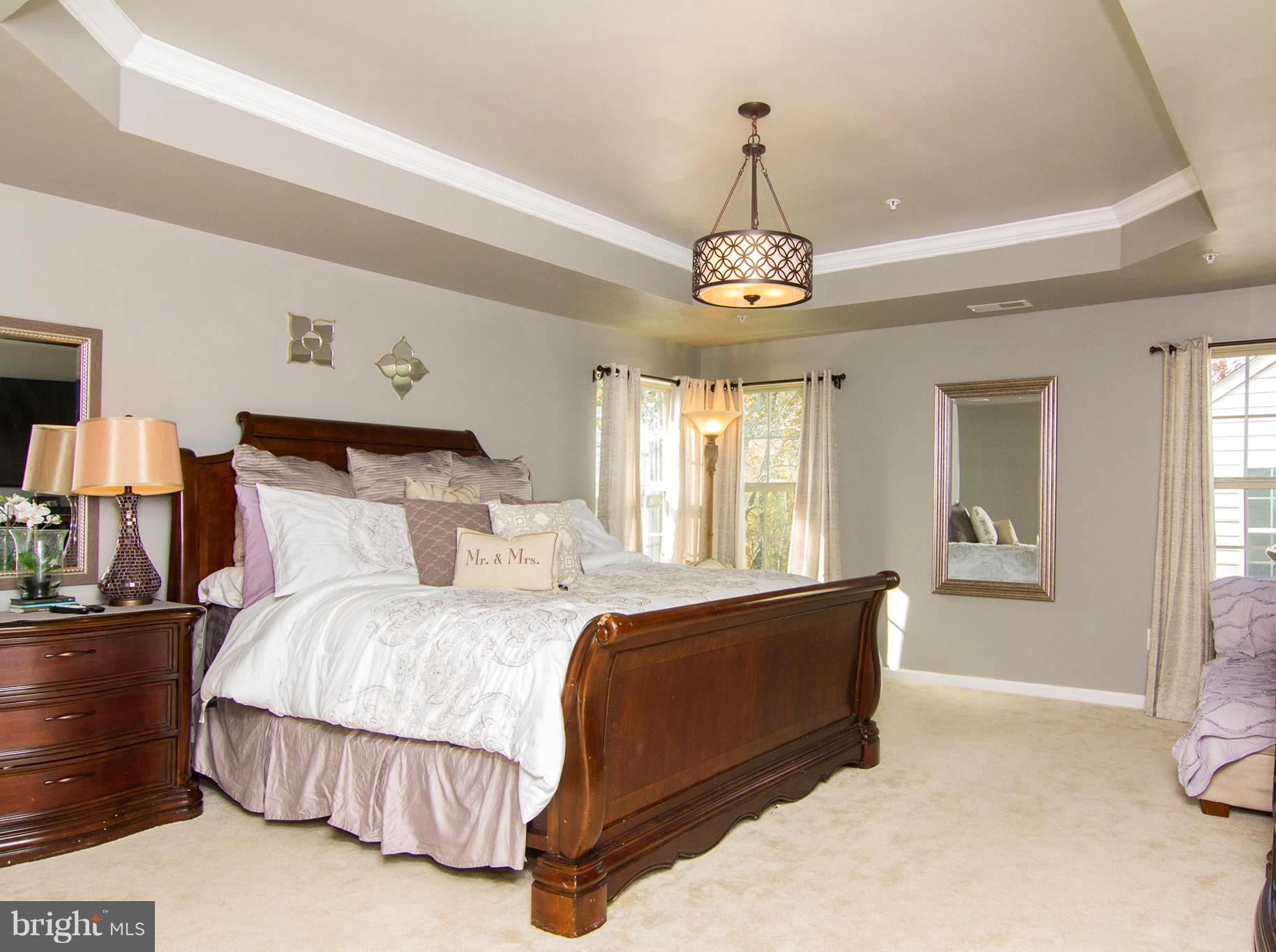 10422 Windlass Run Road Baltimore, MD 21220 - Photo 16 of 30 a spacious bedroom with a bed and window