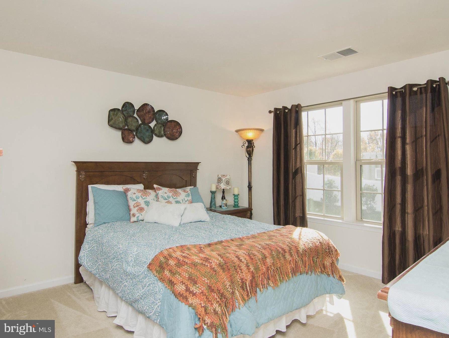 10422 Windlass Run Road Baltimore, MD 21220 - Photo 21 of 30 a bedroom with a large bed and a window