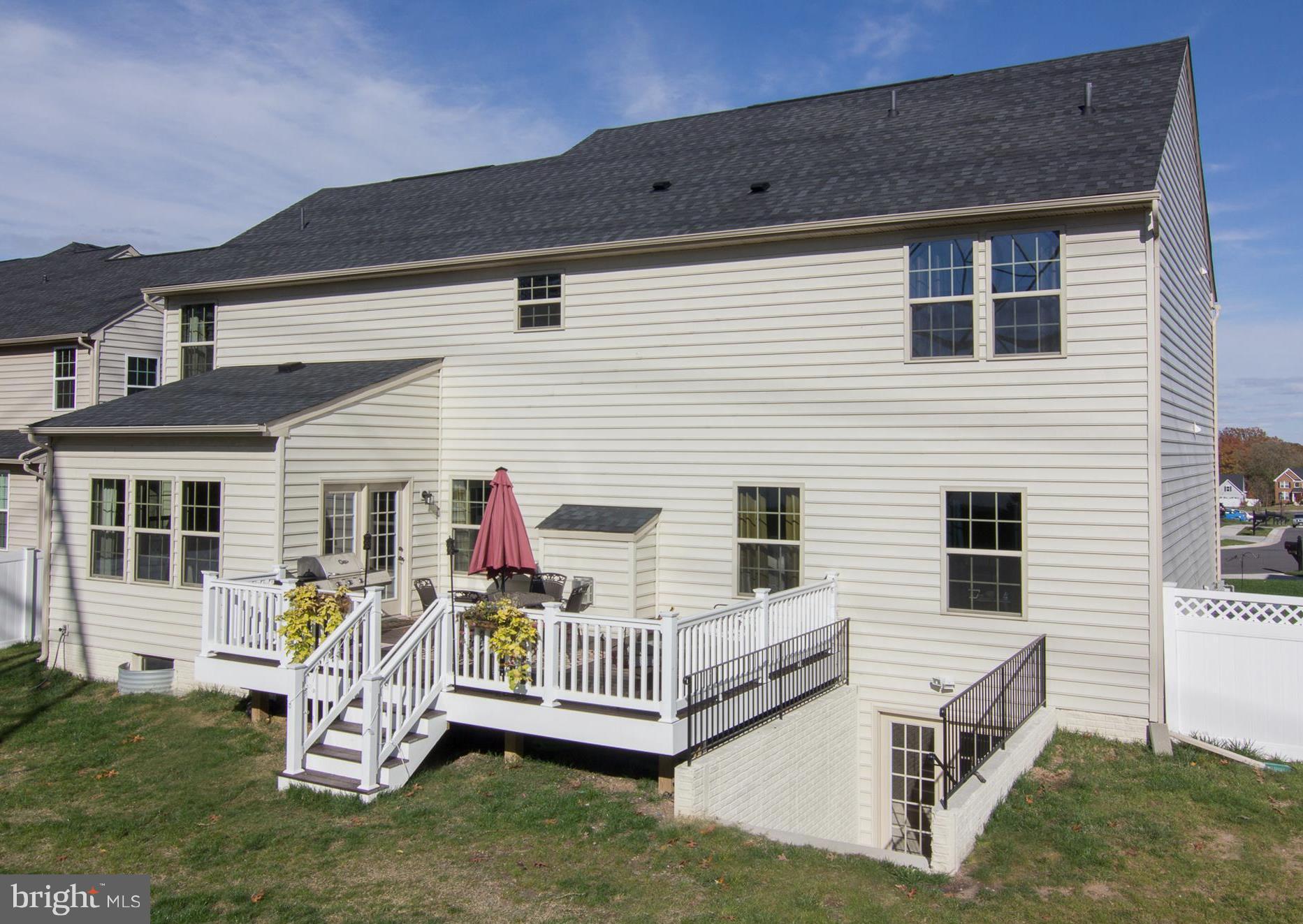 10422 Windlass Run Road Baltimore, MD 21220 - Photo 29 of 30 a view of a house with a yard and deck