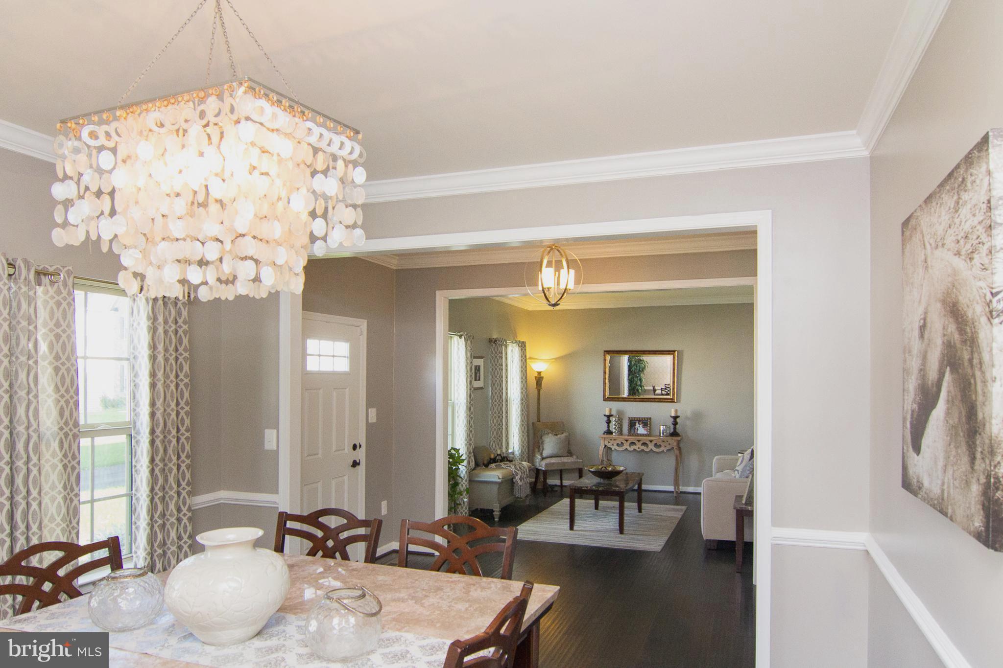 10422 Windlass Run Road Baltimore, MD 21220 - Photo 10 of 30 a living room with furniture and a chandelier