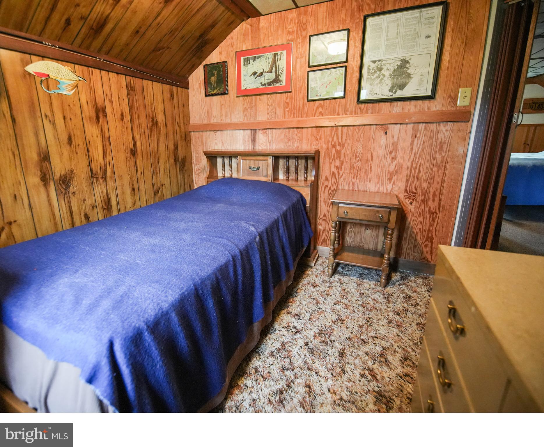 1315 1st Fork Road Austin, PA 16720 - Photo 20 of 25 a bedroom with a bed and a table