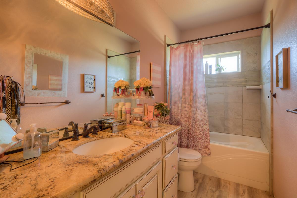 83 Northfork Road Berry Creek, CA 95916 - Photo 44 of 56 a bathroom with a granite countertop sink toilet and shower