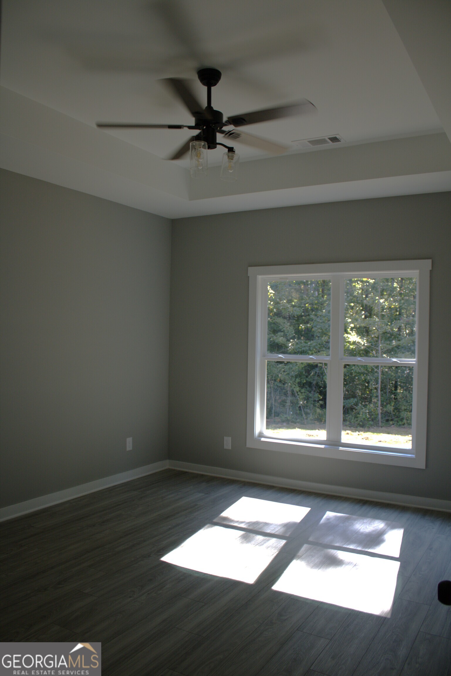 247 North Point Circle Hartwell, GA 30643 - Photo 11 of 18 a view of an empty room with wooden floor and a window
