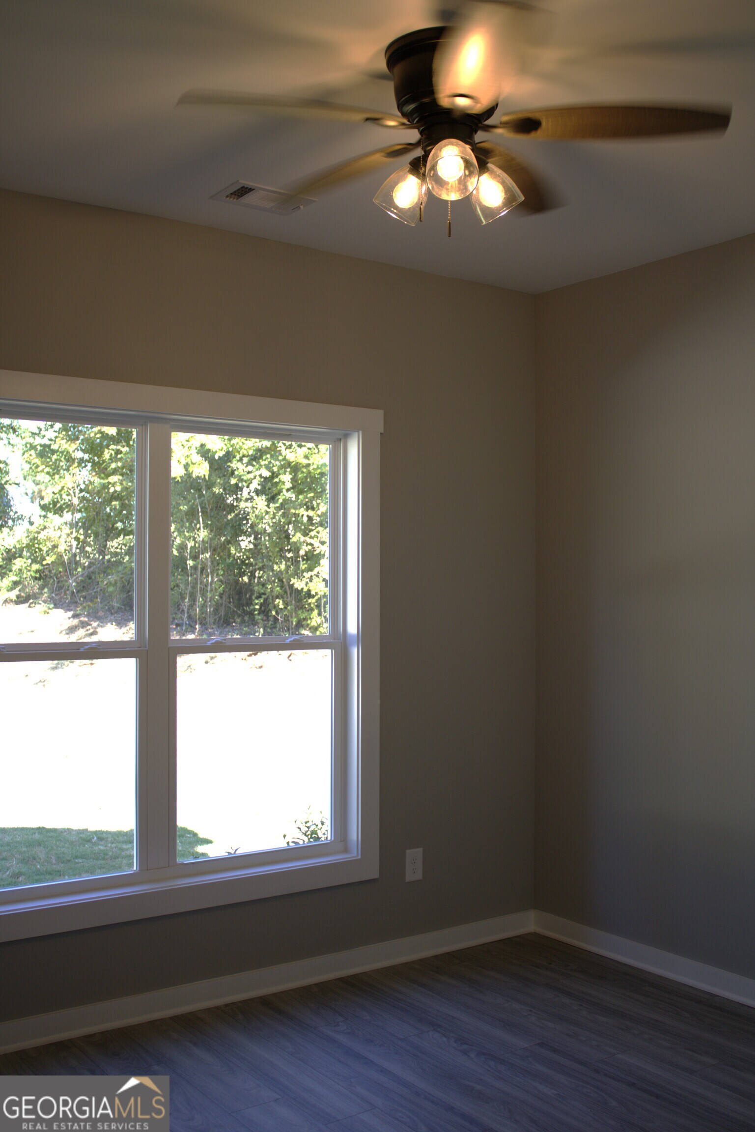 247 North Point Circle Hartwell, GA 30643 - Photo 15 of 18 a view of an empty room with wooden floor and a window