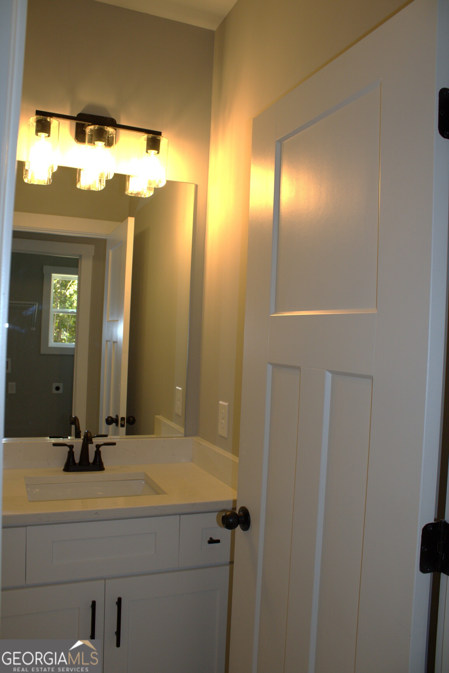247 North Point Circle Hartwell, GA 30643 - Photo 16 of 18 a bathroom with a sink and a mirror