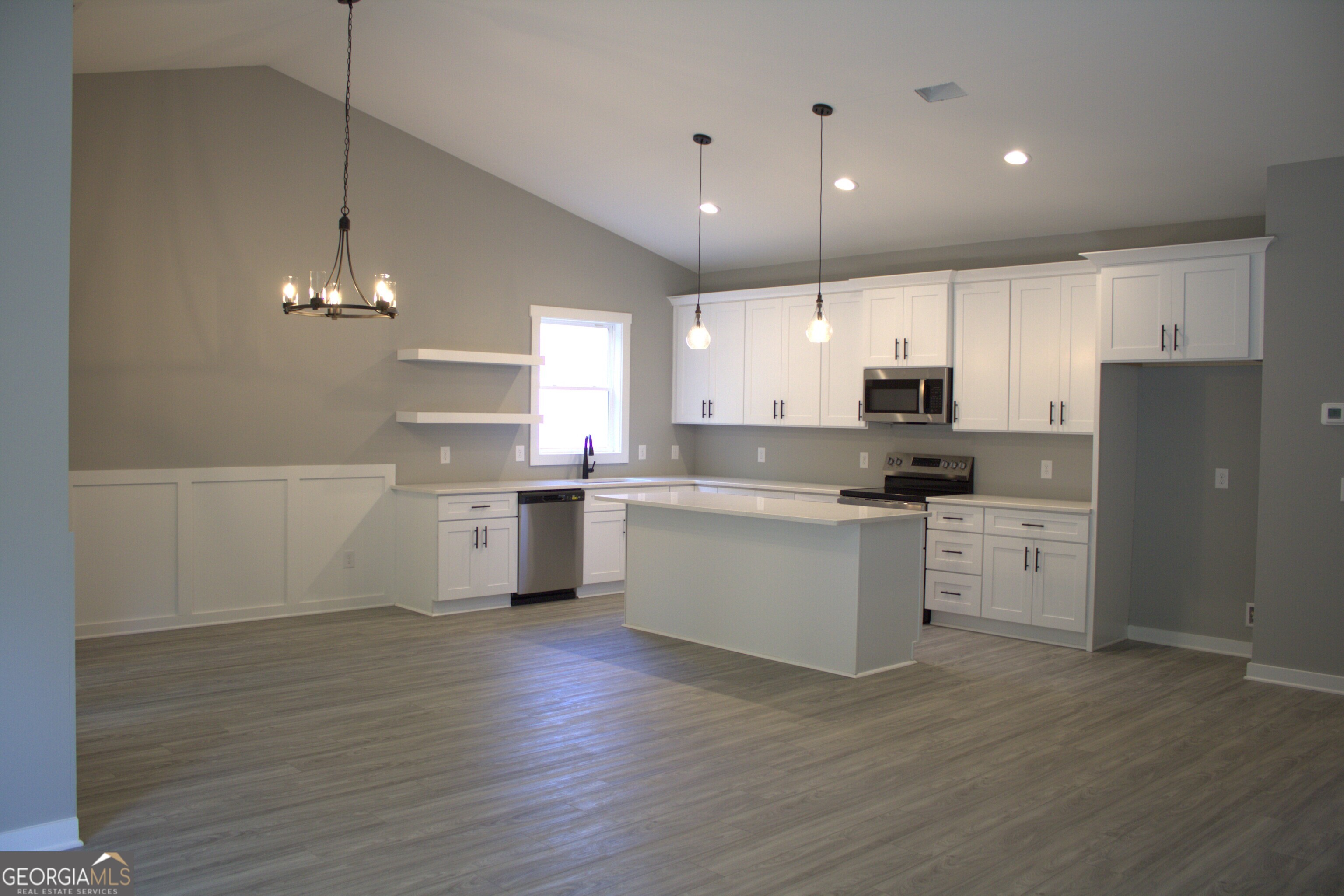 247 North Point Circle Hartwell, GA 30643 - Photo 4 of 18 a kitchen with a white wooden cabinets and white appliances