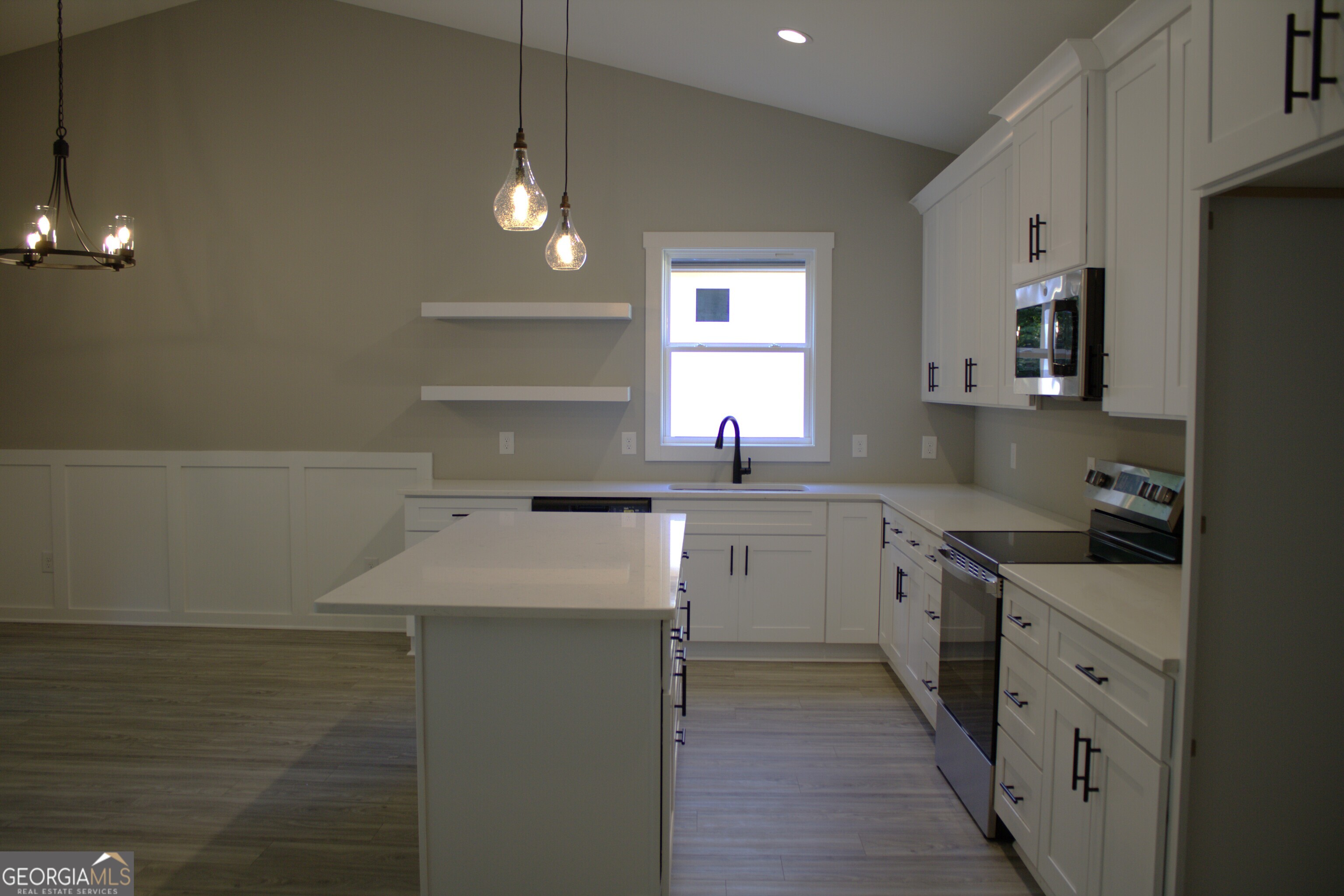 247 North Point Circle Hartwell, GA 30643 - Photo 6 of 18 a kitchen with a sink stove and cabinets