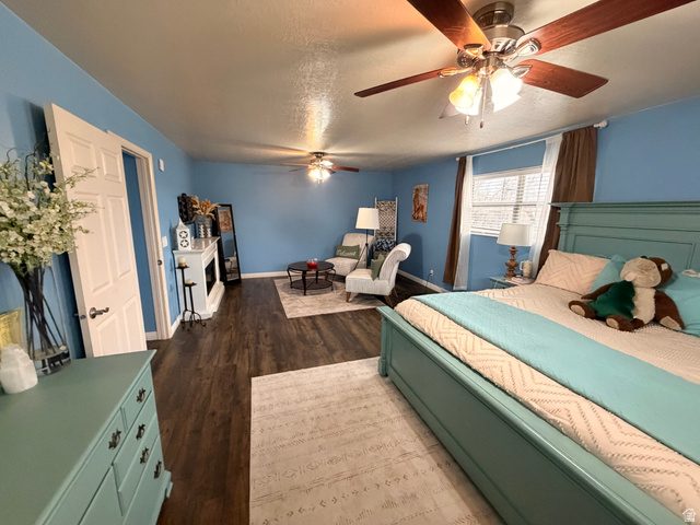 110 South 200 East Springville, UT 84663 - Photo 17 of 23 Bedroom with dark wood finished floors, a ceiling fan, and a textured ceiling