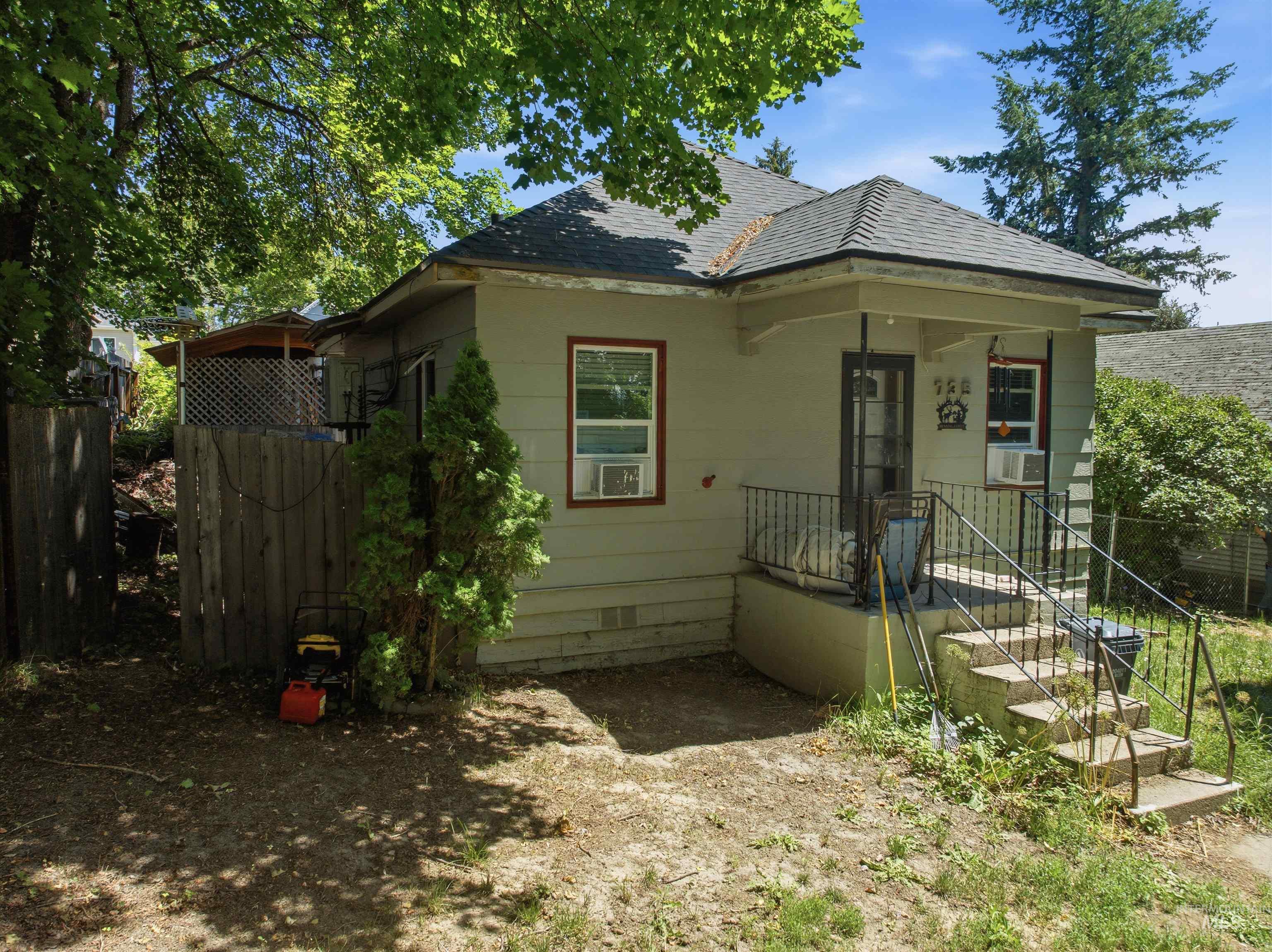 735 Oak Street Potlatch, ID 83855 - Photo 2 of 30 Single-story residence featuring a covered front porch with wrought iron railings and concrete steps