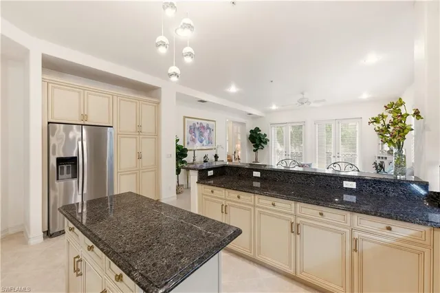 a large kitchen with granite countertop lots of counter top space