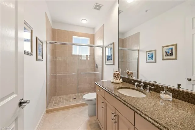 a spacious bathroom with a tub shower and sink