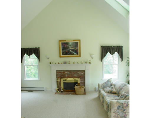 70 Nourse Road Bolton, MA 01740 - Photo 3 of 7 a living room with furniture and a fireplace