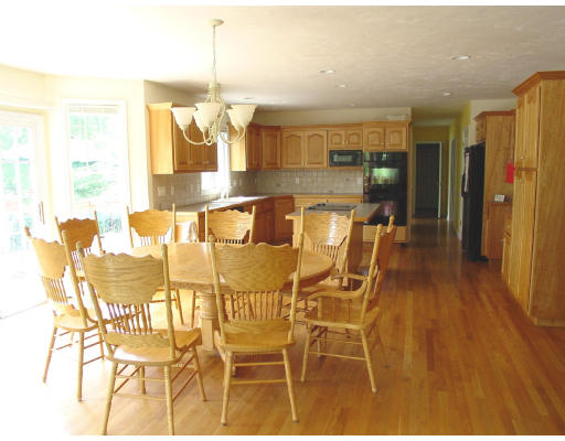 70 Nourse Road Bolton, MA 01740 - Photo 4 of 7 a dining room with furniture and wooden floor