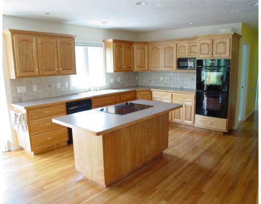 70 Nourse Road Bolton, MA 01740 - Photo 5 of 7 a kitchen that has a sink and a stove in it