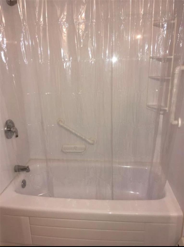 69 West Ridge Street Nesquehoning, PA 18240 - Photo 5 of 8 A well-maintained tub-shower combination offers daily comfort and practicality.