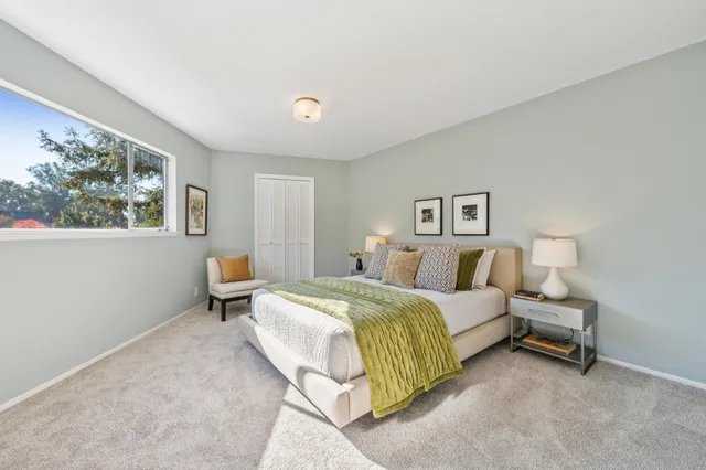 a bedroom with a bed and a couch