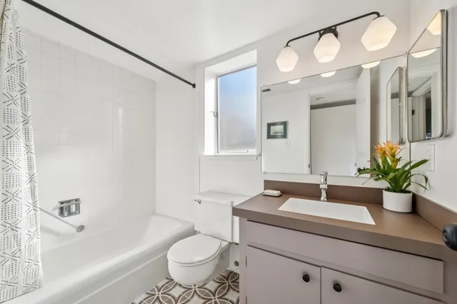 a bathroom with a sink a vanity and a mirror