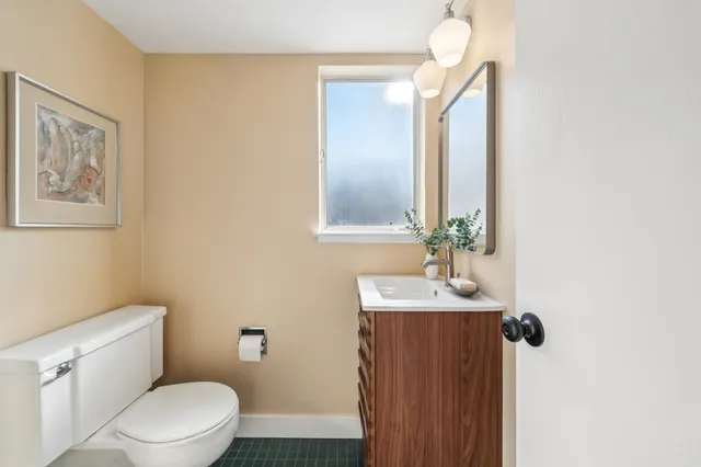 a view of a bathroom from a hallway