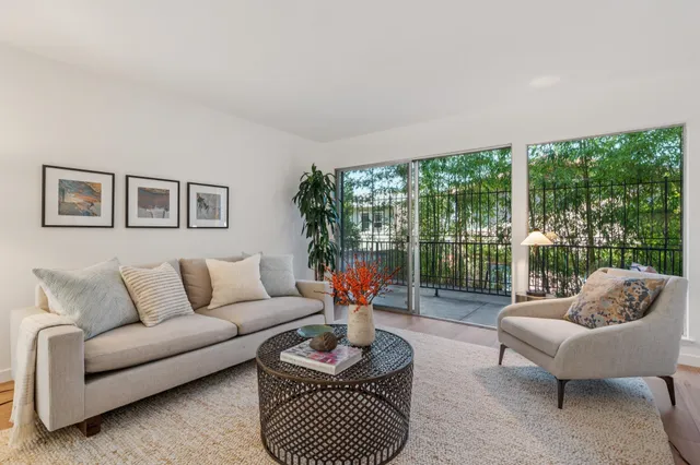 a view of a chair and tables in the balcony