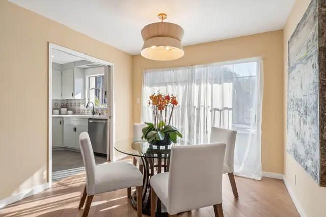 a dining room with furniture and window