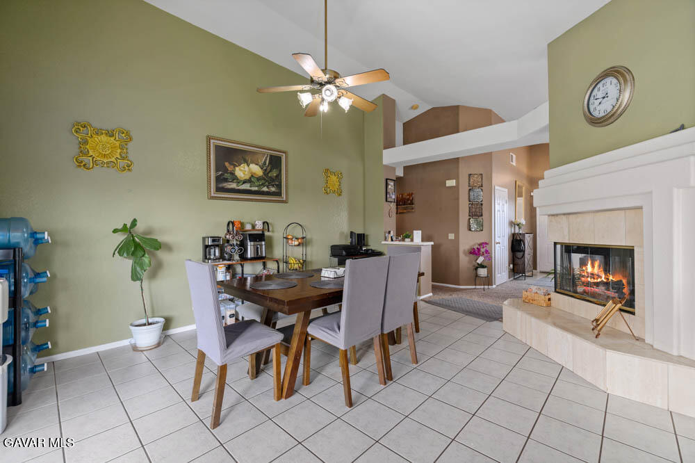 2425 Williams Court Rosamond, CA 93560 - Photo 12 of 35 a view of a dining room with furniture and a chandelier fan