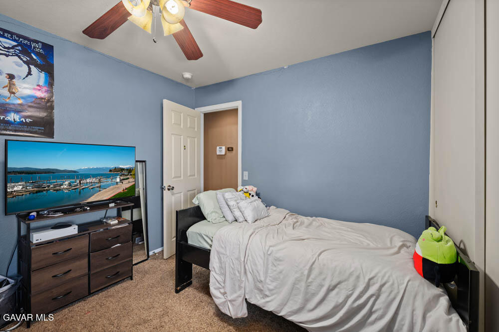 2425 Williams Court Rosamond, CA 93560 - Photo 21 of 35 a bedroom with a bed and a television