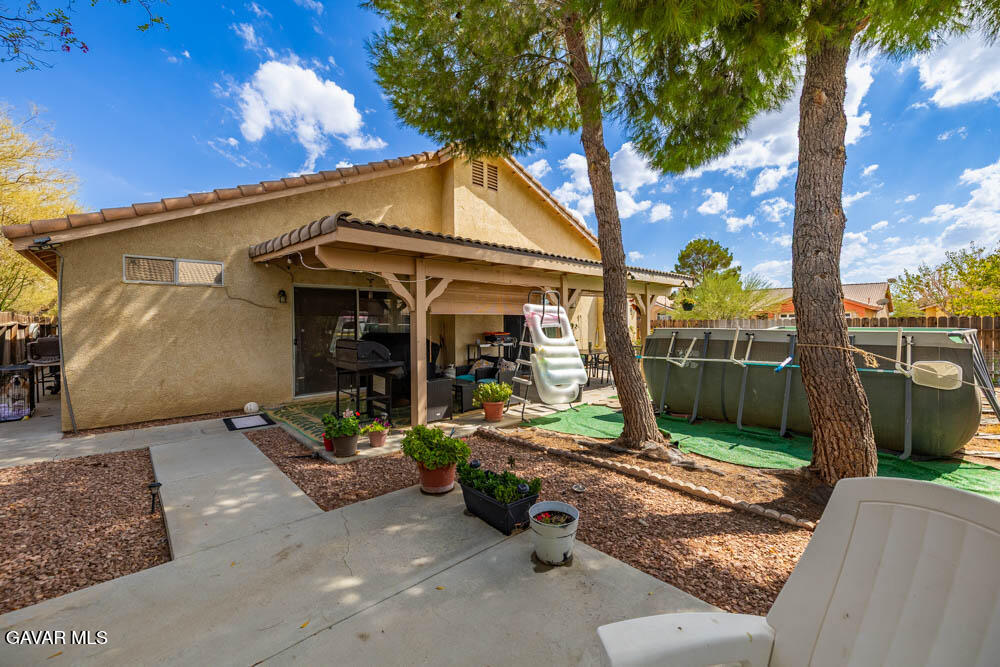 2425 Williams Court Rosamond, CA 93560 - Photo 29 of 35 a view of a chair and tables in the patio