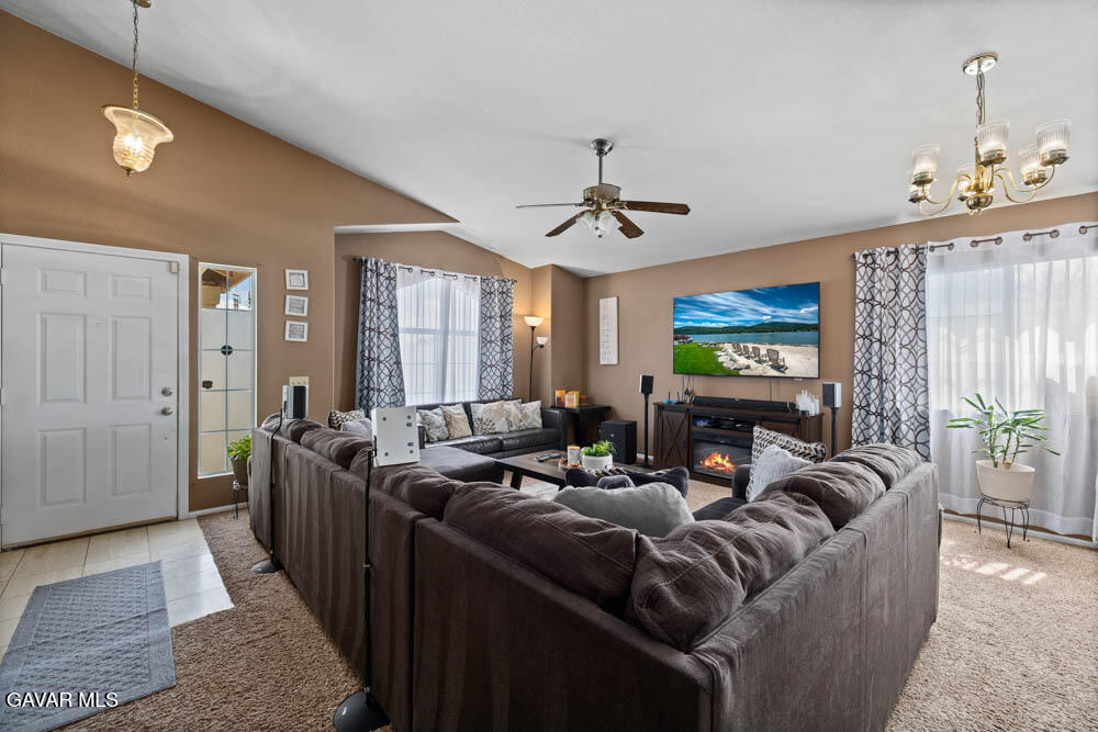 2425 Williams Court Rosamond, CA 93560 - Photo 4 of 35 a living room with furniture a window and a flat screen tv