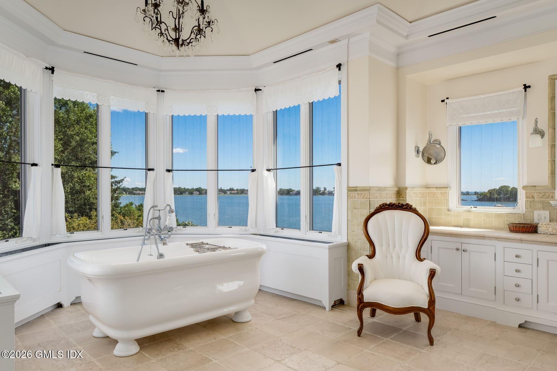 108 Cedar Cliff Road Riverside, CT 06878 - Photo 31 of 49 a bathroom with a sink and a large window