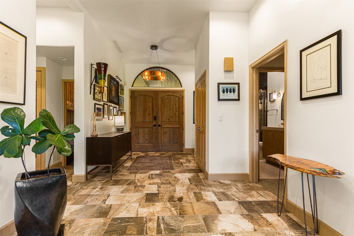 1031 Boreas Pass Road Breckenridge, CO 80424 - Photo 13 of 49 a view of a hallway with wooden floor and a potted plant