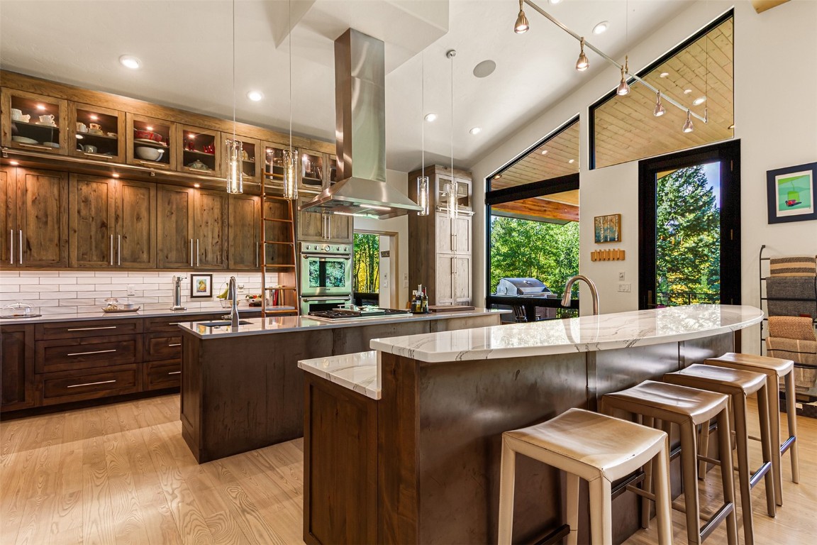 1031 Boreas Pass Road Breckenridge, CO 80424 - Photo 26 of 49 a kitchen with a stove a sink and a refrigerator