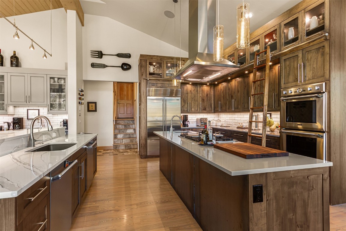 1031 Boreas Pass Road Breckenridge, CO 80424 - Photo 27 of 49 a kitchen with stainless steel appliances granite countertop a sink and a stove