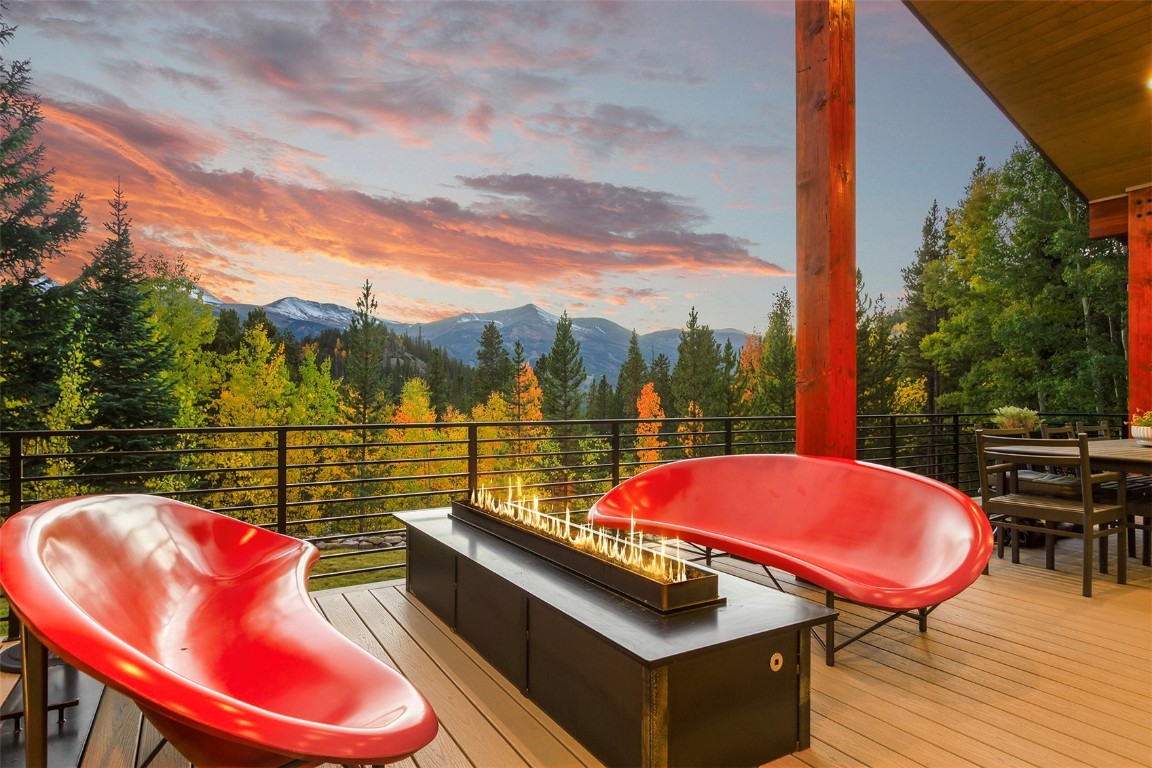 1031 Boreas Pass Road Breckenridge, CO 80424 - Photo 33 of 49 a outdoor sitting area with furniture and wooden floor