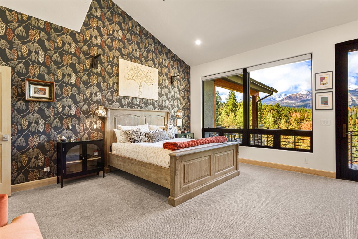 1031 Boreas Pass Road Breckenridge, CO 80424 - Photo 35 of 49 a living room with a large bed and a large window with outer view