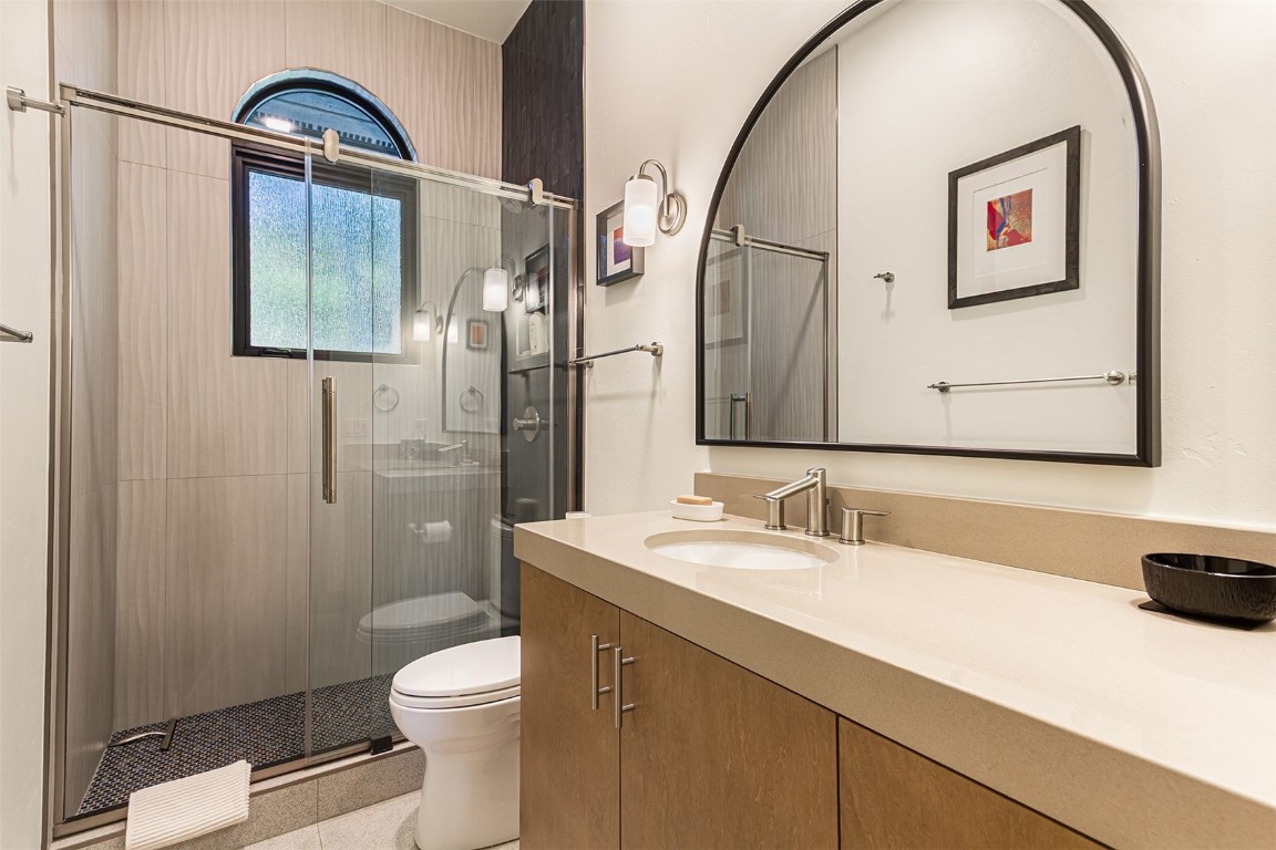 1031 Boreas Pass Road Breckenridge, CO 80424 - Photo 40 of 49 a bathroom with a sink a toilet and shower