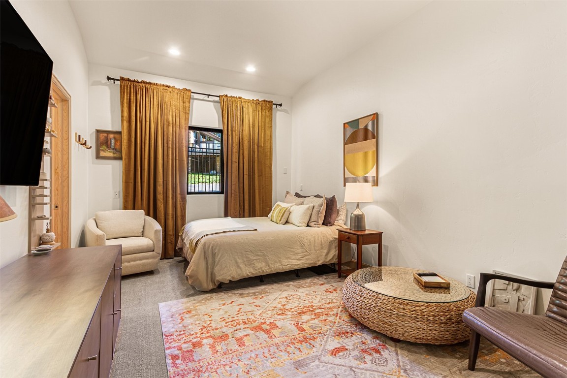 1031 Boreas Pass Road Breckenridge, CO 80424 - Photo 43 of 49 a spacious bedroom with two beds and a couch
