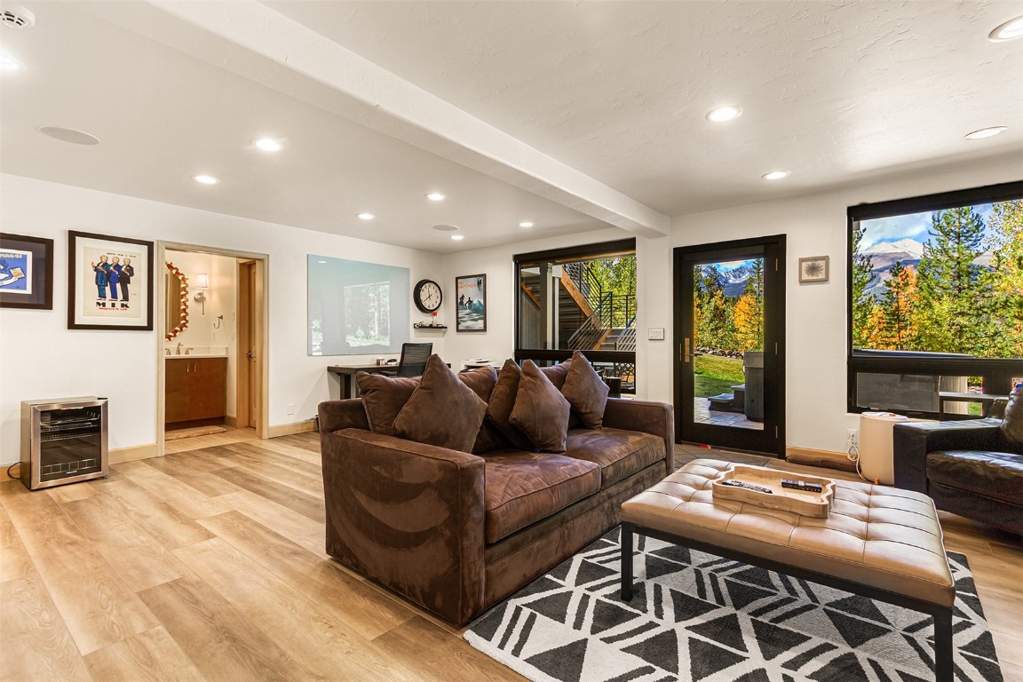 1031 Boreas Pass Road Breckenridge, CO 80424 - Photo 44 of 49 a living room with furniture and a flat screen tv