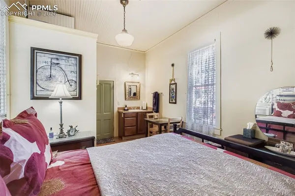 a bed room with a bed and a chair