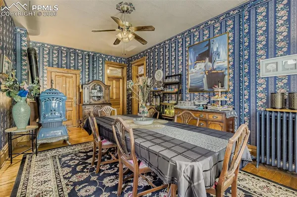 a living room with furniture a rug and a chandelier