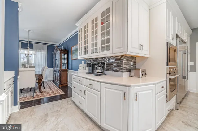 a dining table chairs and view kitchen