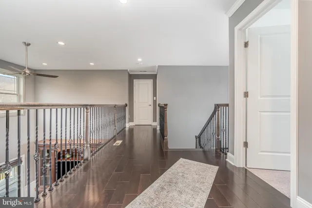a spacious bathroom with a sink mirror and vanity