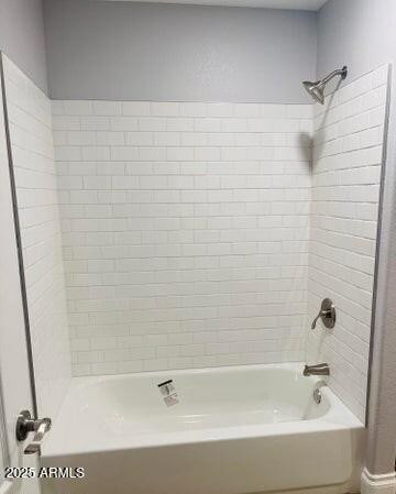 12817 West Alvarado Road Avondale, AZ 85392 - Photo 11 of 15 a bathroom with a bathtub