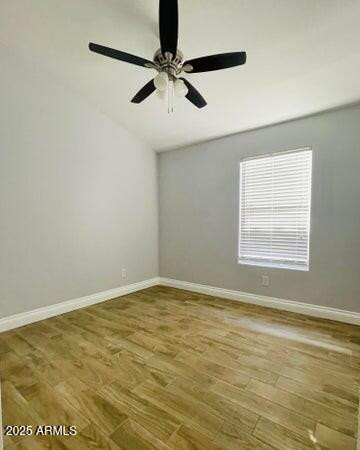 12817 West Alvarado Road Avondale, AZ 85392 - Photo 12 of 15 an empty room with a window