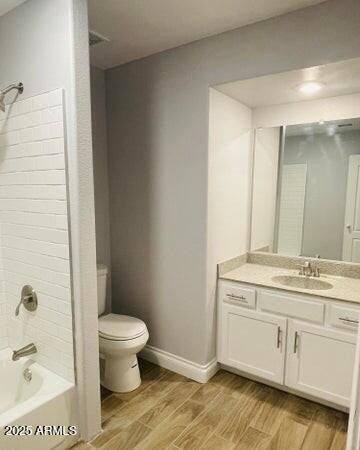 12817 West Alvarado Road Avondale, AZ 85392 - Photo 13 of 15 a bathroom with a granite countertop toilet a sink and a mirror