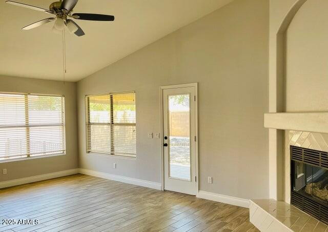 12817 West Alvarado Road Avondale, AZ 85392 - Photo 6 of 15 an empty room with wooden floor fan and windows