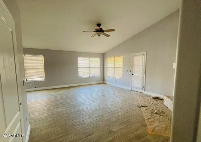 12817 West Alvarado Road Avondale, AZ 85392 - Photo 7 of 15 wooden floor in an empty room with a window