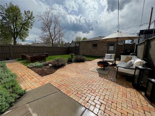 a view of backyard with seating space