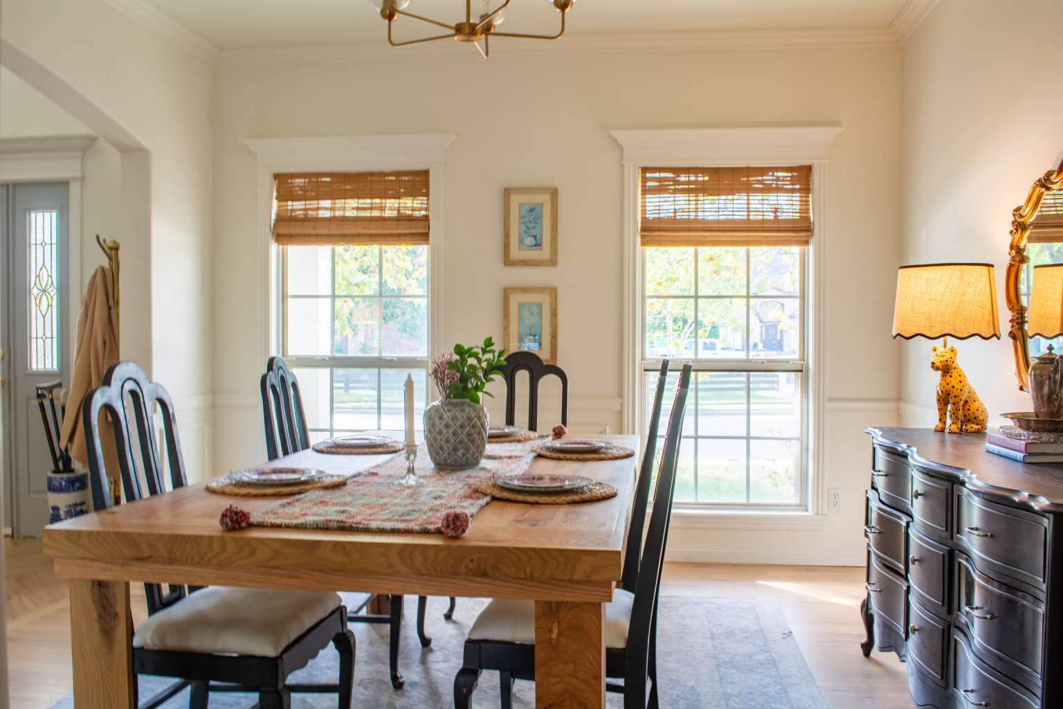 115 South Forest Ridge Boulevard Broken Arrow, OK 74014 - Photo 24 of 50 Spacious interior featuring a light wood dining table, white walls with wainscoting, and large windows with natural light