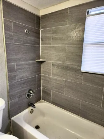 a bathroom with a sink and a bathtub
