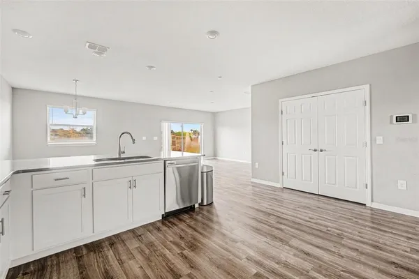 a view of a kitchen with wooden floor